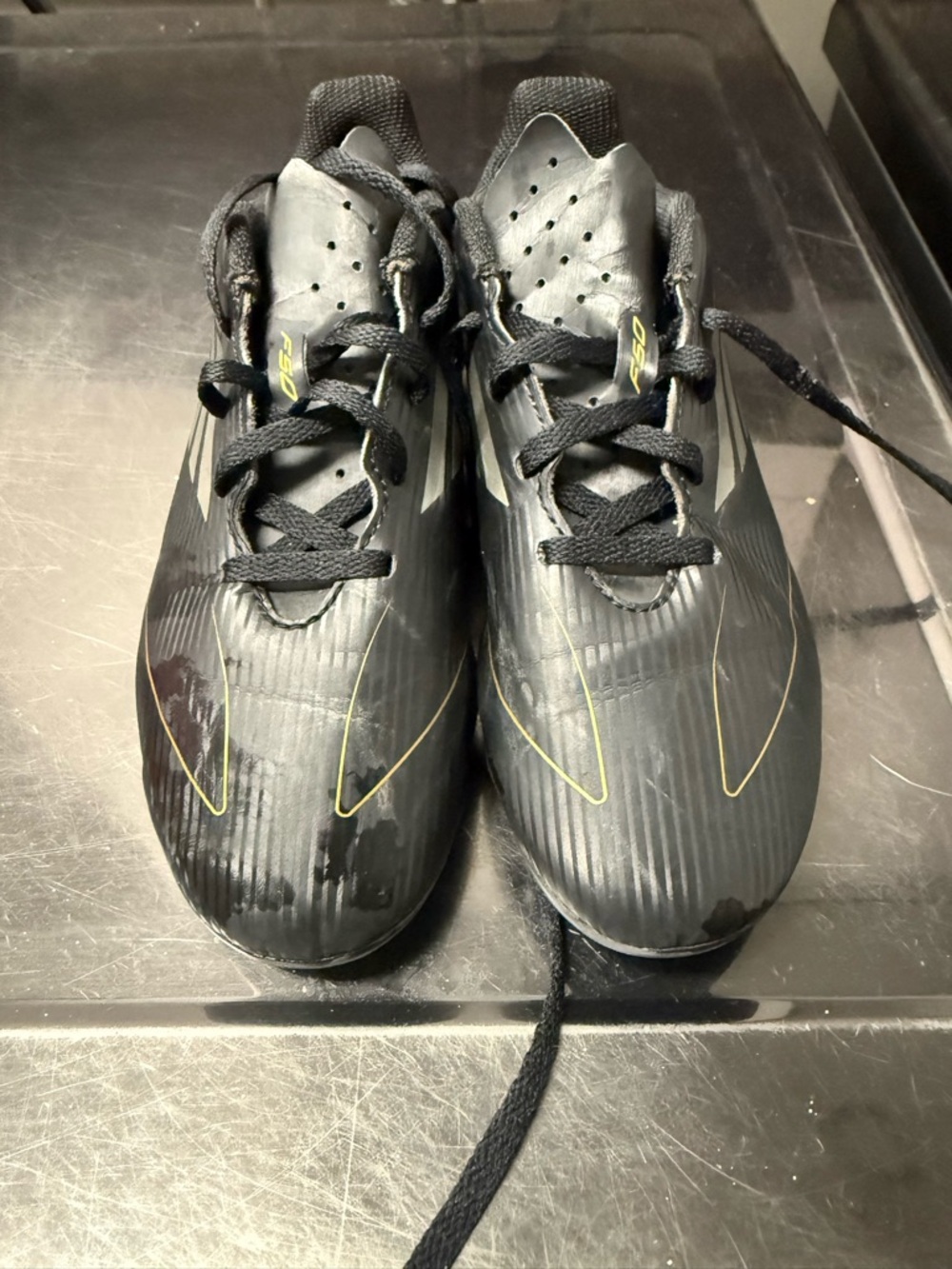 adidas Kids Black Soccer Cleats with Yellow Accent